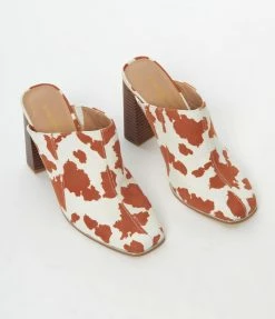 OUR LOVE LETTER INC Heels & Wedges White & Brown Cow Print Suede Mule Heels