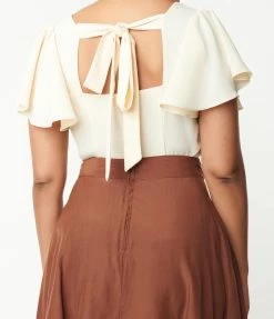 Trending Unique Vintage Cream Flutter Sleeve Blouse