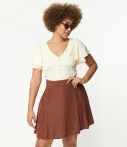 Trending Unique Vintage Cream Flutter Sleeve Blouse